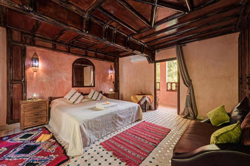 Postel nebo postele na pokoji v ubytování Riad Oussagou