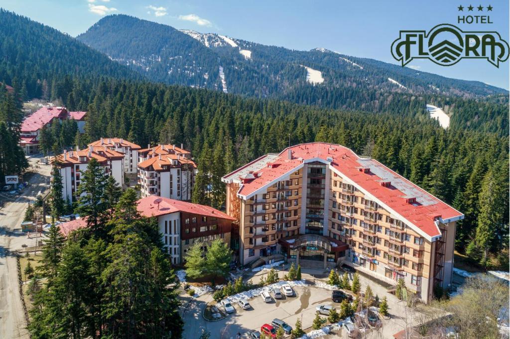 an aerial view of a hotel in the mountains at Flora Hotel - Apartments in Borovets
