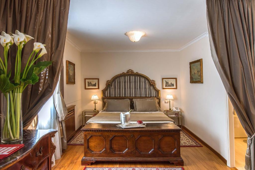 Postel nebo postele na pokoji v ubytování Hotel Forum
