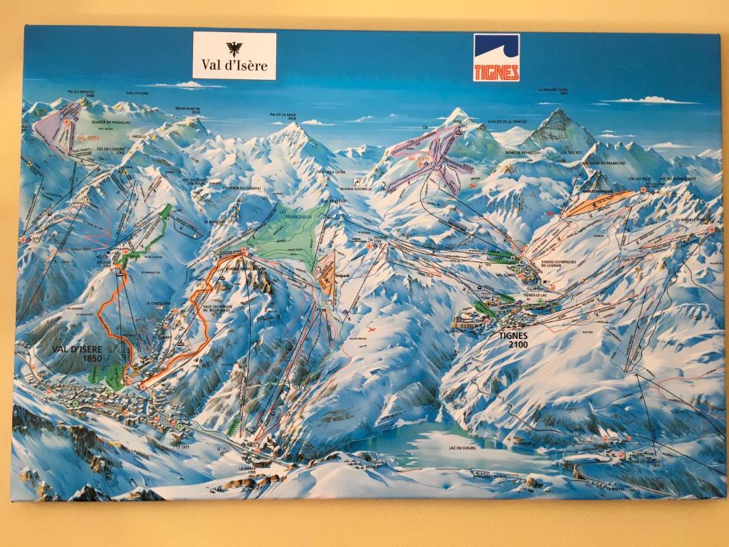a poster of a snow covered mountain range at Les Balcons de Bellevarde in Val-d'Isère