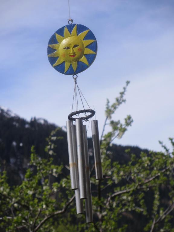 a bunch of candles hanging from a string at B&B Gottardo in Airolo