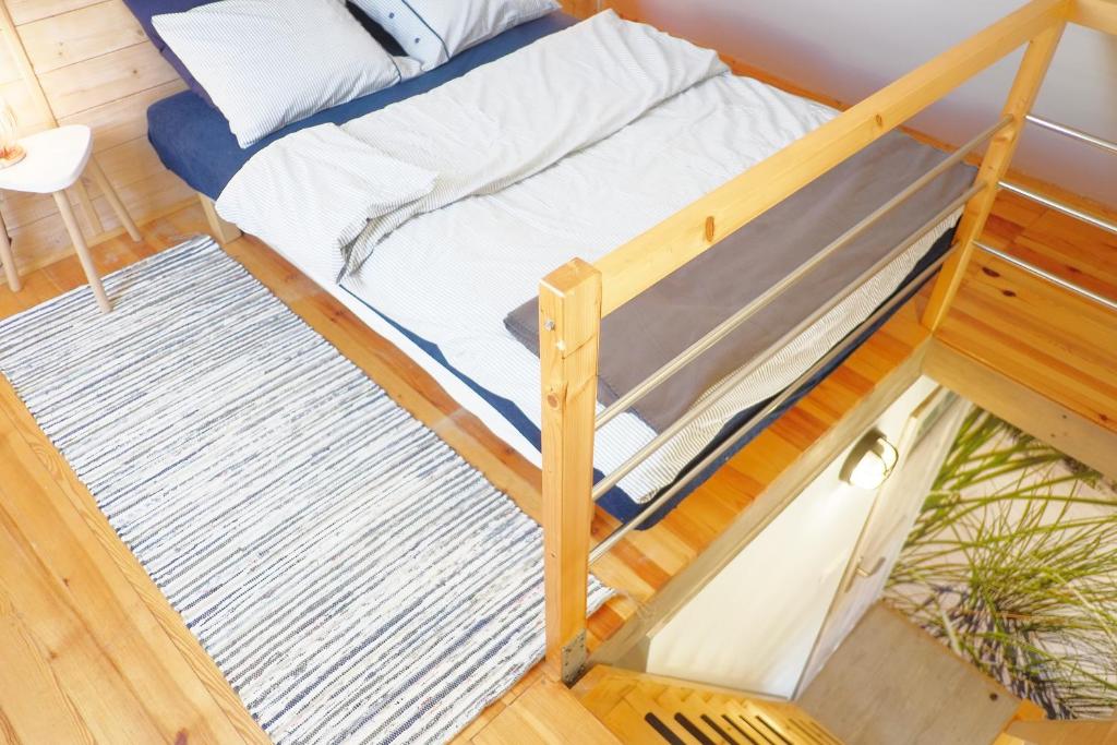 Postel nebo postele na pokoji v ubytování Domek Drewniany