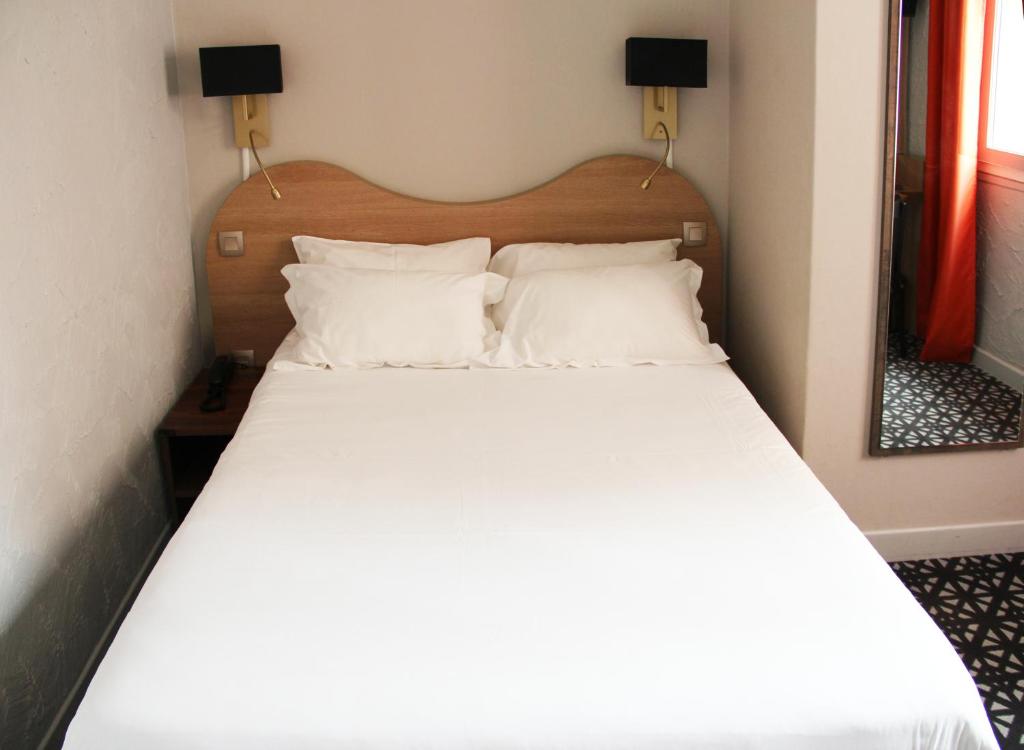 Postel nebo postele na pokoji v ubytování Hôtel Beau Rivage