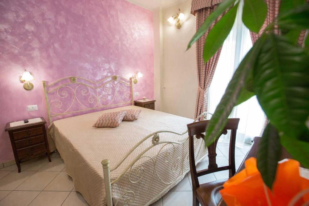 Łóżko lub łóżka w pokoju w obiekcie B&B Le due gioie