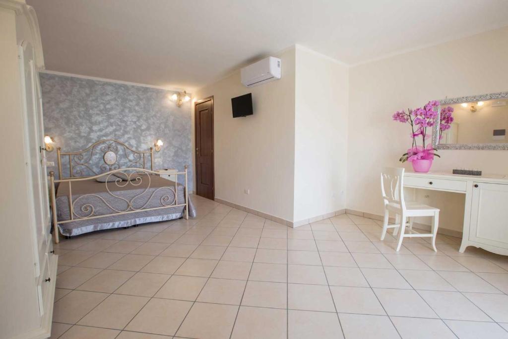 Łóżko lub łóżka w pokoju w obiekcie B&B Le due gioie