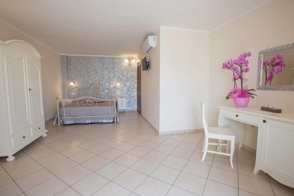 Łóżko lub łóżka w pokoju w obiekcie B&B Le due gioie