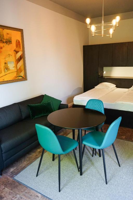 Posezení v ubytování Guest House Senasis Pastas