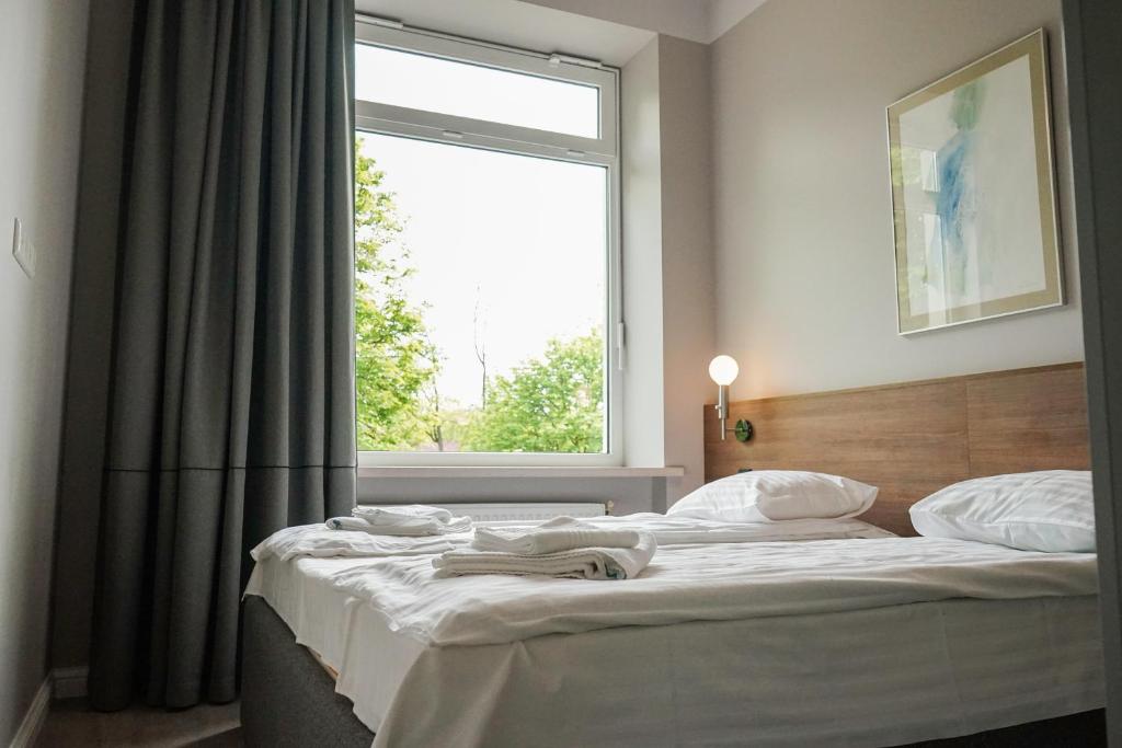 Postel nebo postele na pokoji v ubytování Guest House Senasis Pastas