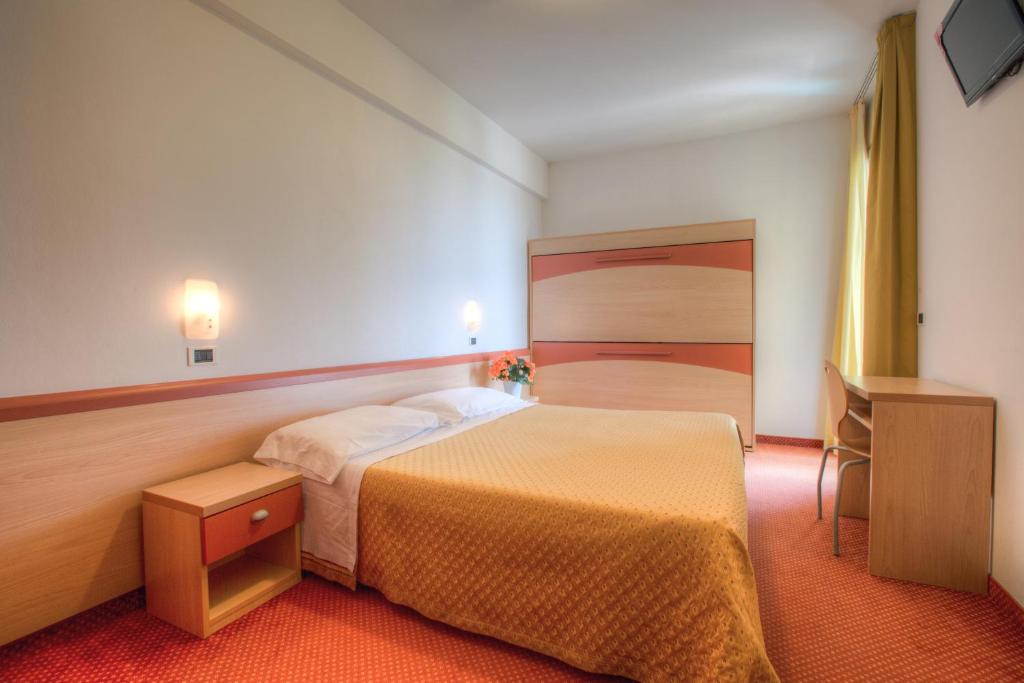 Postel nebo postele na pokoji v ubytování Hotel Tilmar