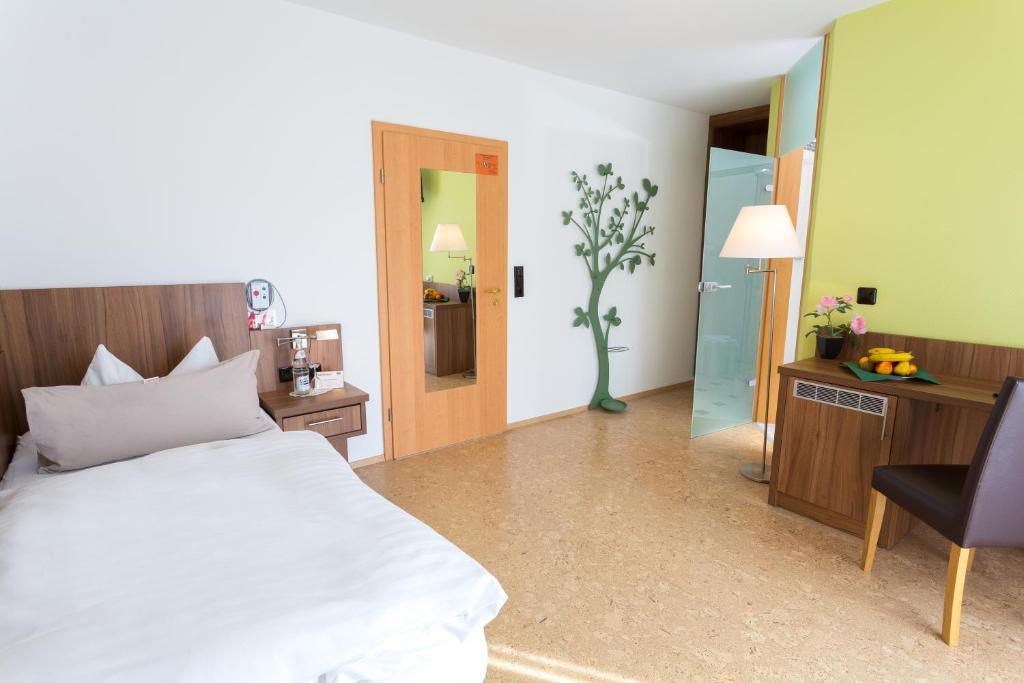 Postel nebo postele na pokoji v ubytování Hotel Muschinsky