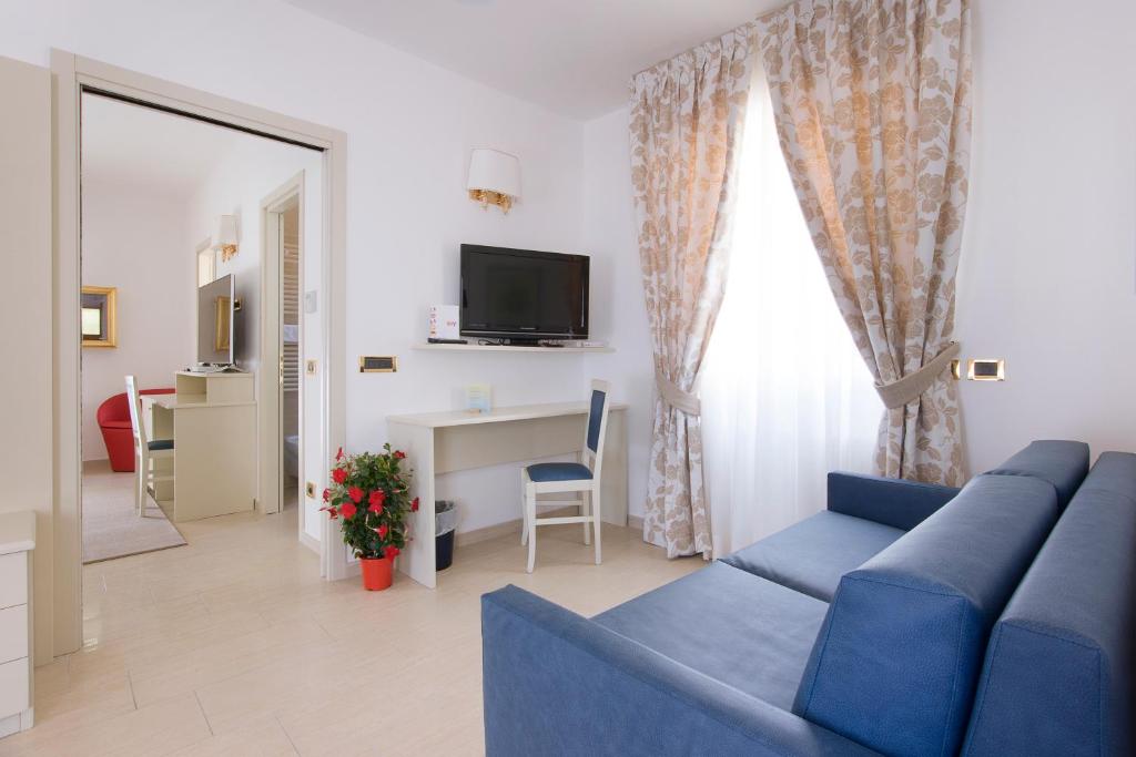 TV a/nebo společenská místnost v ubytování Hotel Ristorante Toscana