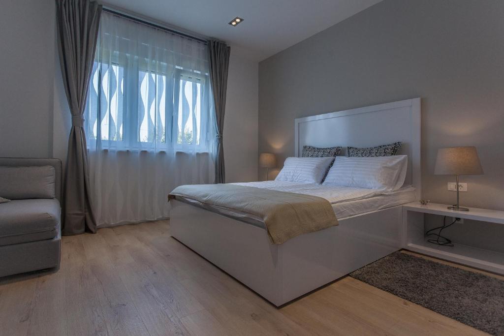 Postel nebo postele na pokoji v ubytování Priuli Suites