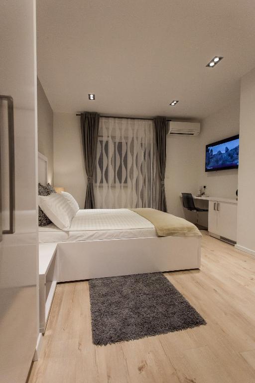 Postel nebo postele na pokoji v ubytování Priuli Suites