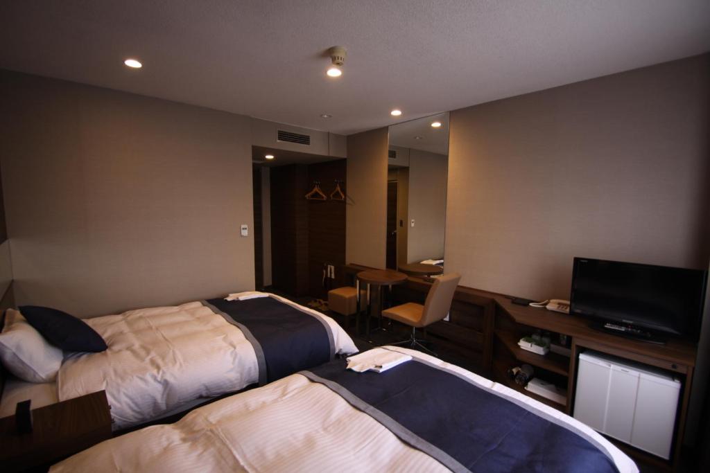 TV a/nebo společenská místnost v ubytování Hotel Il Credo Gifu