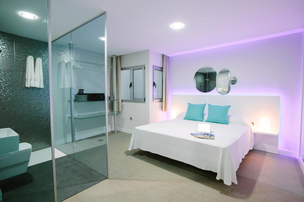 A bed or beds in a room at Valentina Beach