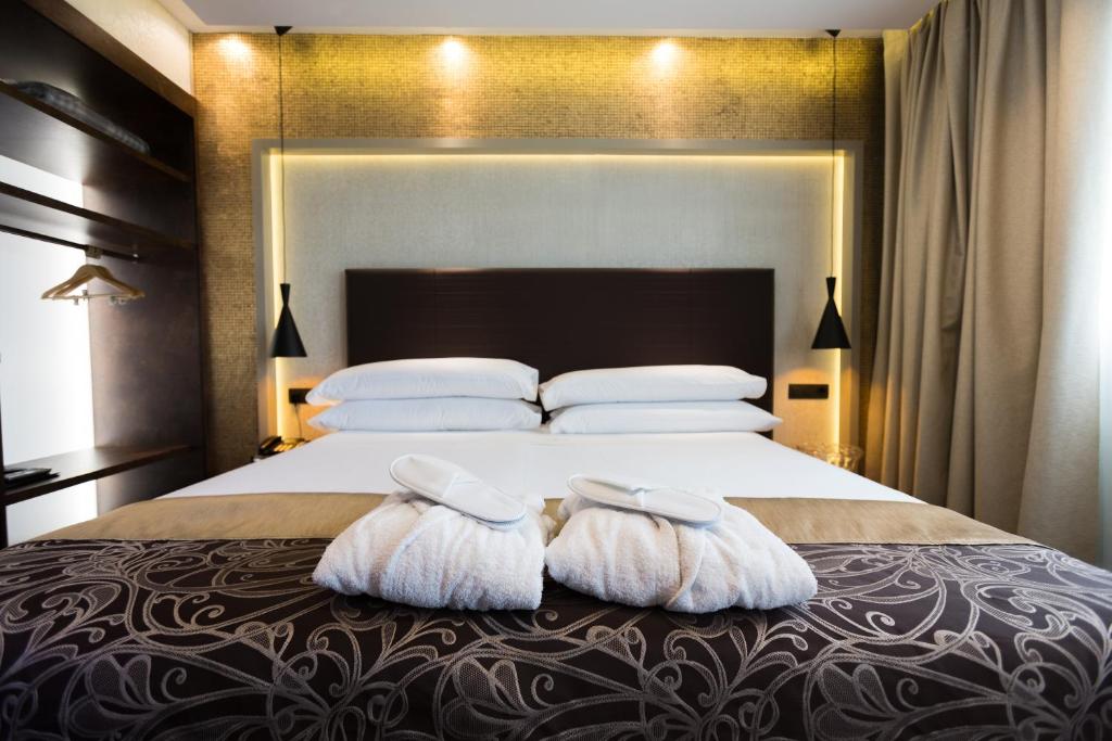 Postel nebo postele na pokoji v ubytování Felix Hotel