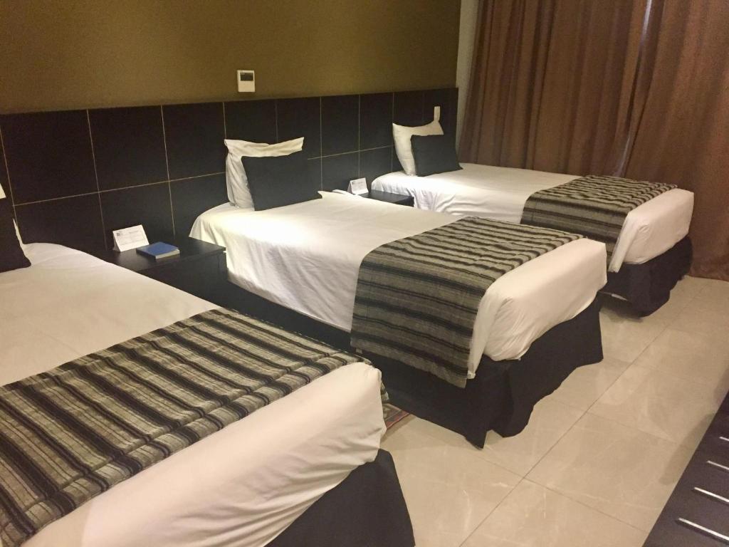 Postel nebo postele na pokoji v ubytování Hotel Atlântico Tower