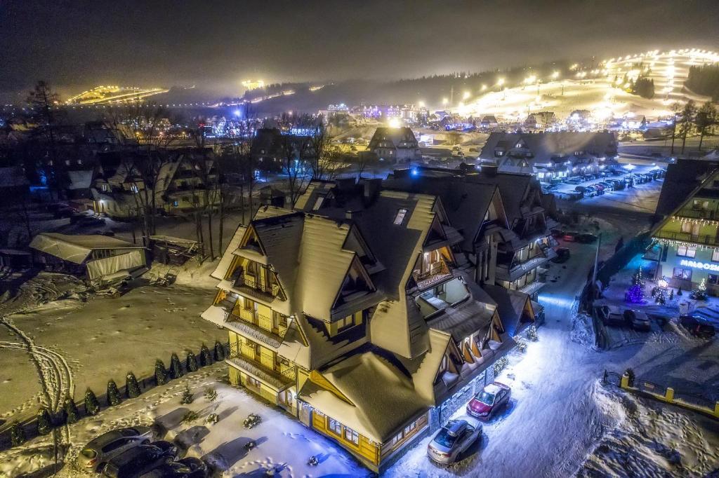 an aerial view of a building at night at Pensjonat Dziubas - 5 minut na piechotę do stacji narciarskiej Kotelnica i term Bania, parking przy obiekcie in Białka Tatrzańska