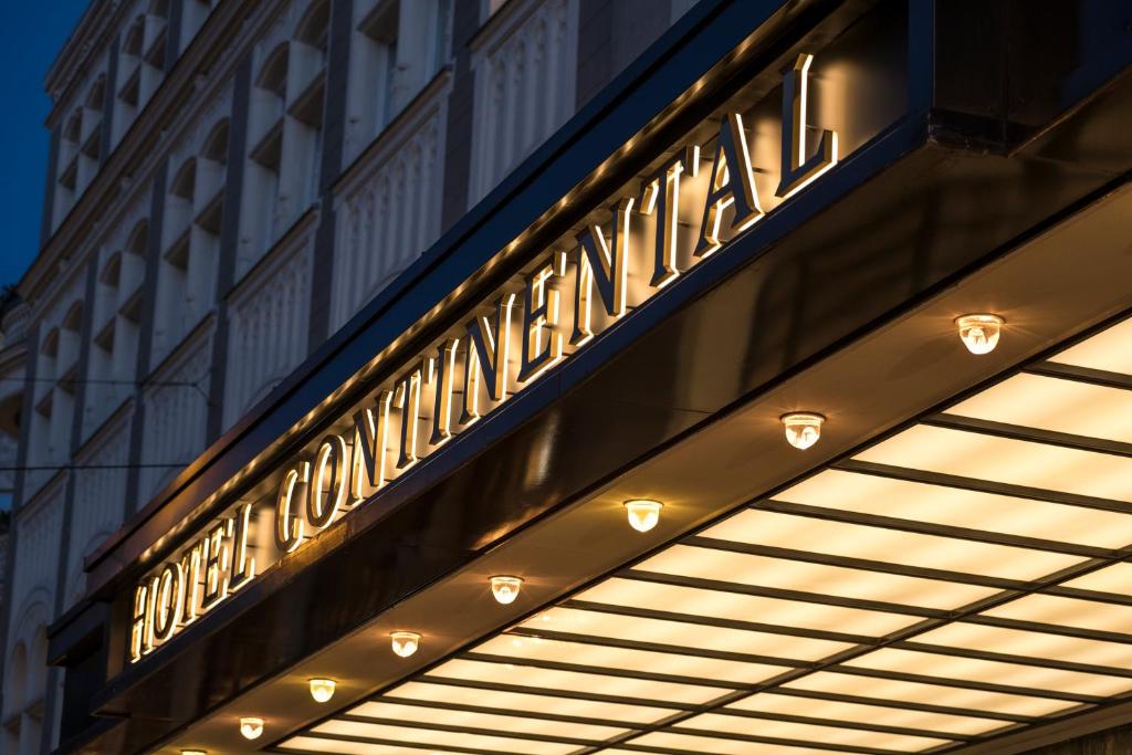 a sign on a building that reads the new york exchange at Hotel Continental in Oslo