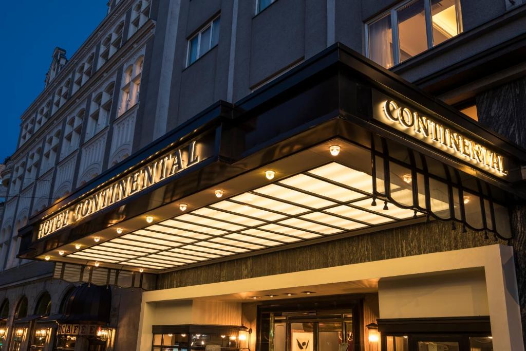 a building with a sign on the front of it at Hotel Continental in Oslo