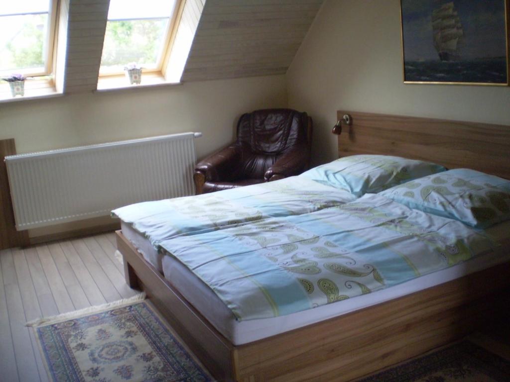 Postel nebo postele na pokoji v ubytování Molo Užeiga Inn