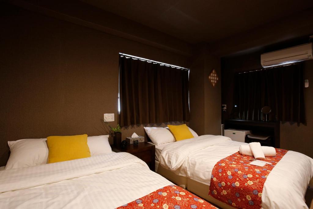 Postel nebo postele na pokoji v ubytování Sumiya Spa & Hotel