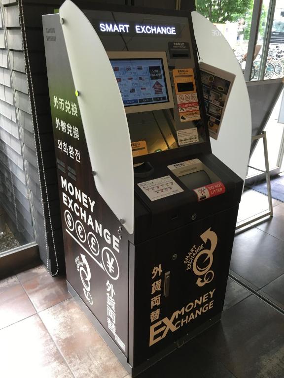 a shark exchange machine with a surfboard in it at Sotetsu Fresa Inn Higashi Shinjuku in Tokyo