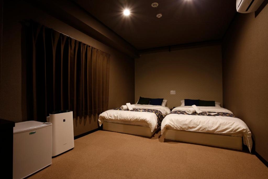 Postel nebo postele na pokoji v ubytování Sumiya Spa & Hotel