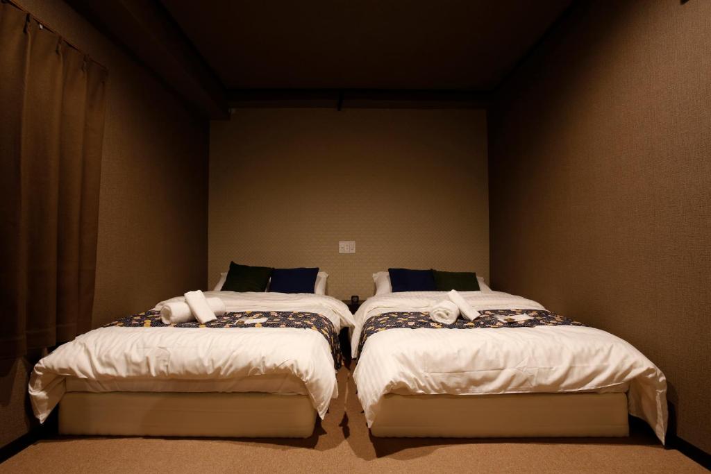 Postel nebo postele na pokoji v ubytování Sumiya Spa & Hotel