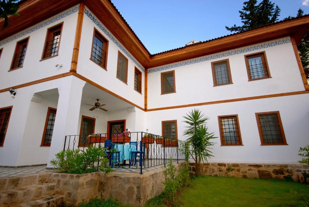an exterior view of a large white building at Villa Porta in Antalya