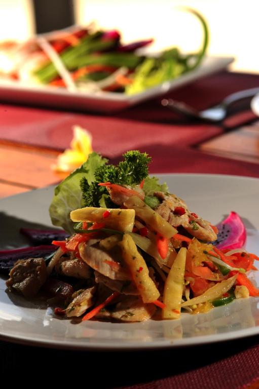 a white plate of food on a table at Cocotinos Sekotong Lombok in Sekotong