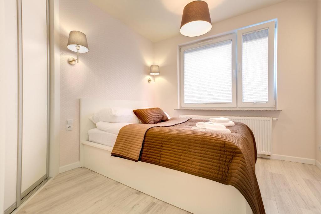 Łóżko lub łóżka w pokoju w obiekcie Apartment Royal III