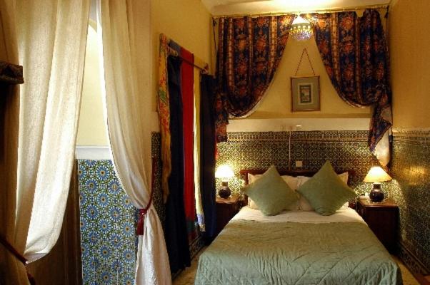 Postel nebo postele na pokoji v ubytování Riad Dalia