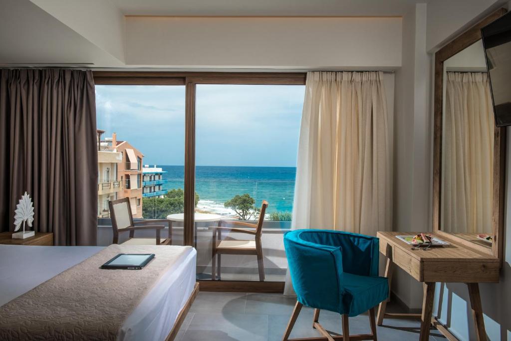 a hotel room with a view of the ocean at Harma Boutique Hotel in Hersonissos