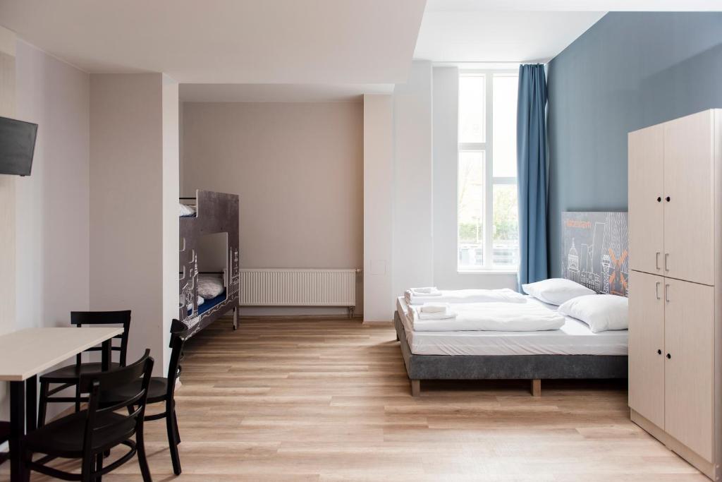 Postel nebo postele na pokoji v ubytování a&o Copenhagen Nørrebro