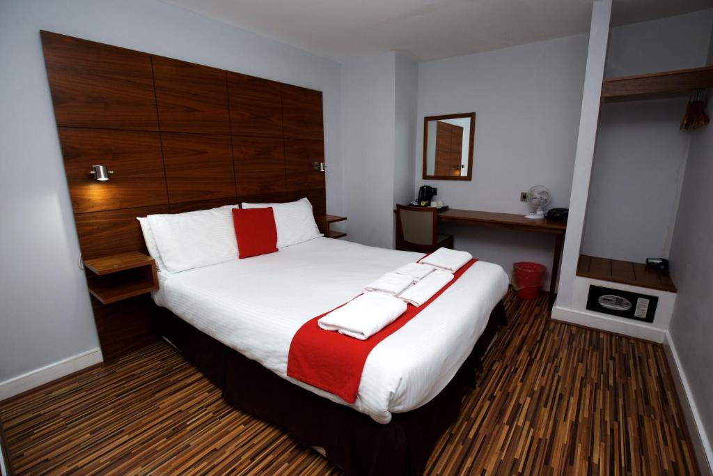 Cama o camas de una habitación en Cocoon @ International Inn + Apartments