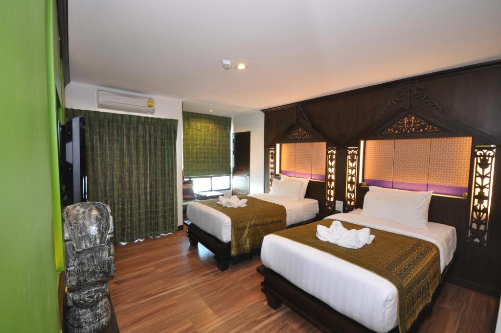 Postel nebo postele na pokoji v ubytování Chalelarn Hotel Hua Hin