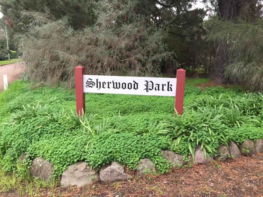 a sign that reads sherwood park in a garden at Sherwood Park bed and breakfast in Somerville