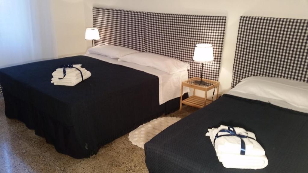 Postel nebo postele na pokoji v ubytování In Vacanza da Marinella