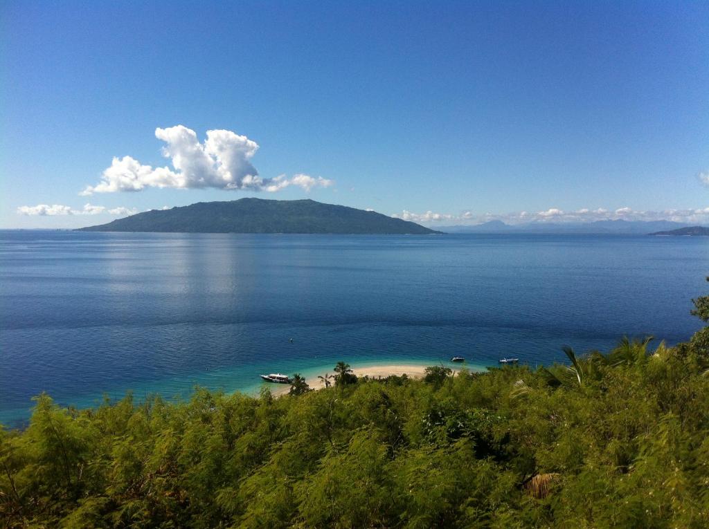 an island in the middle of a large body of water at Coco Komba Lodge in Nosy Komba