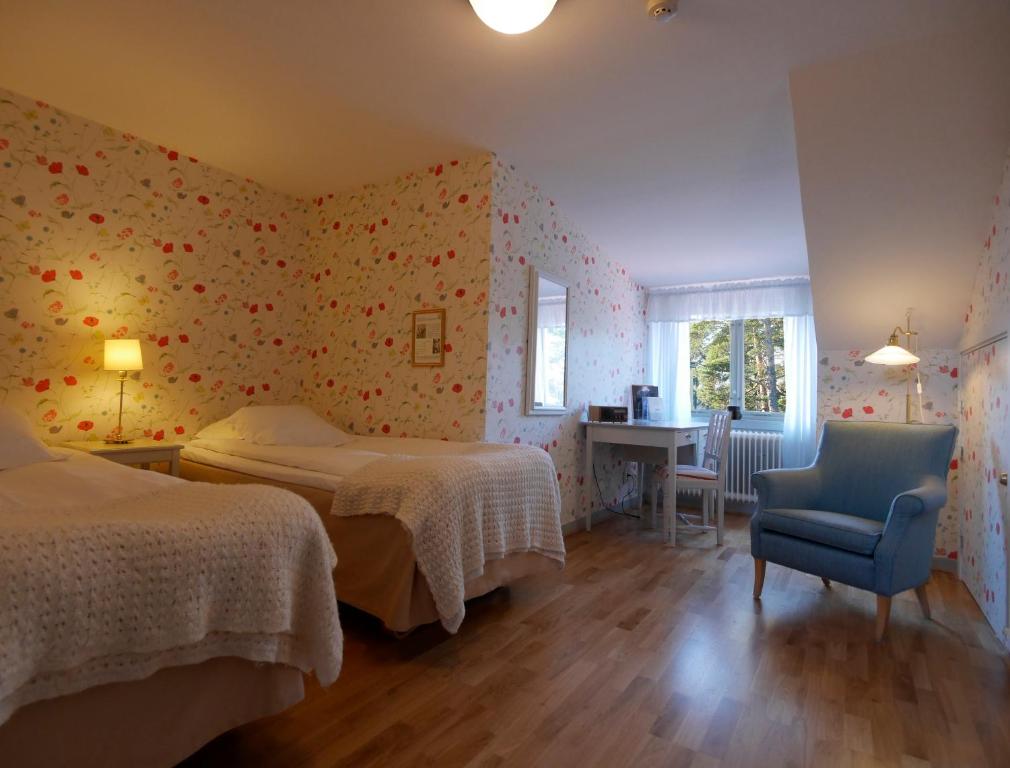 Postel nebo postele na pokoji v ubytování Sigtunastiftelsen Hotell & Konferens