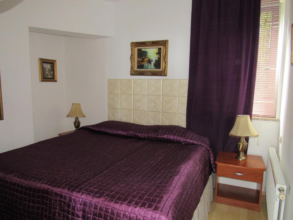 Łóżko lub łóżka w pokoju w obiekcie Apartments Villa Palme