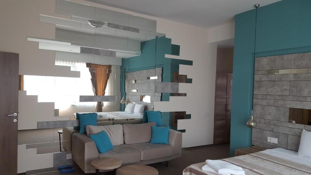 Postel nebo postele na pokoji v ubytování Hotel Emka