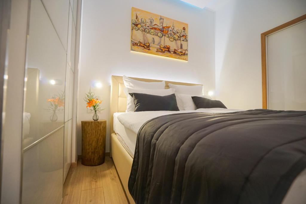 Posteľ alebo postele v izbe v ubytovaní Destino City Apartments