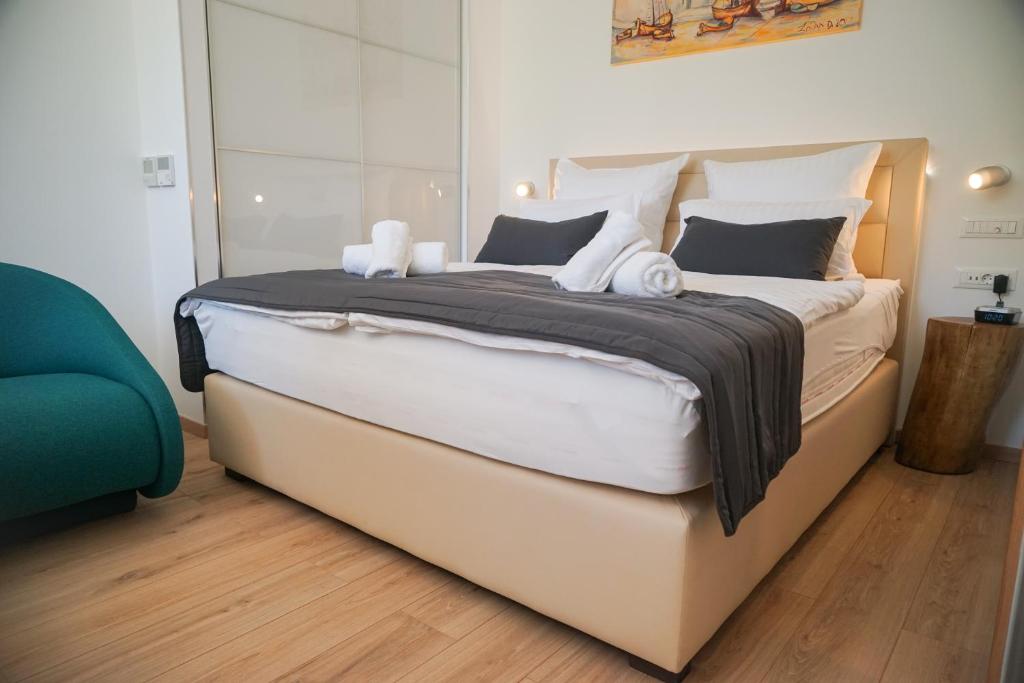Posteľ alebo postele v izbe v ubytovaní Destino City Apartments