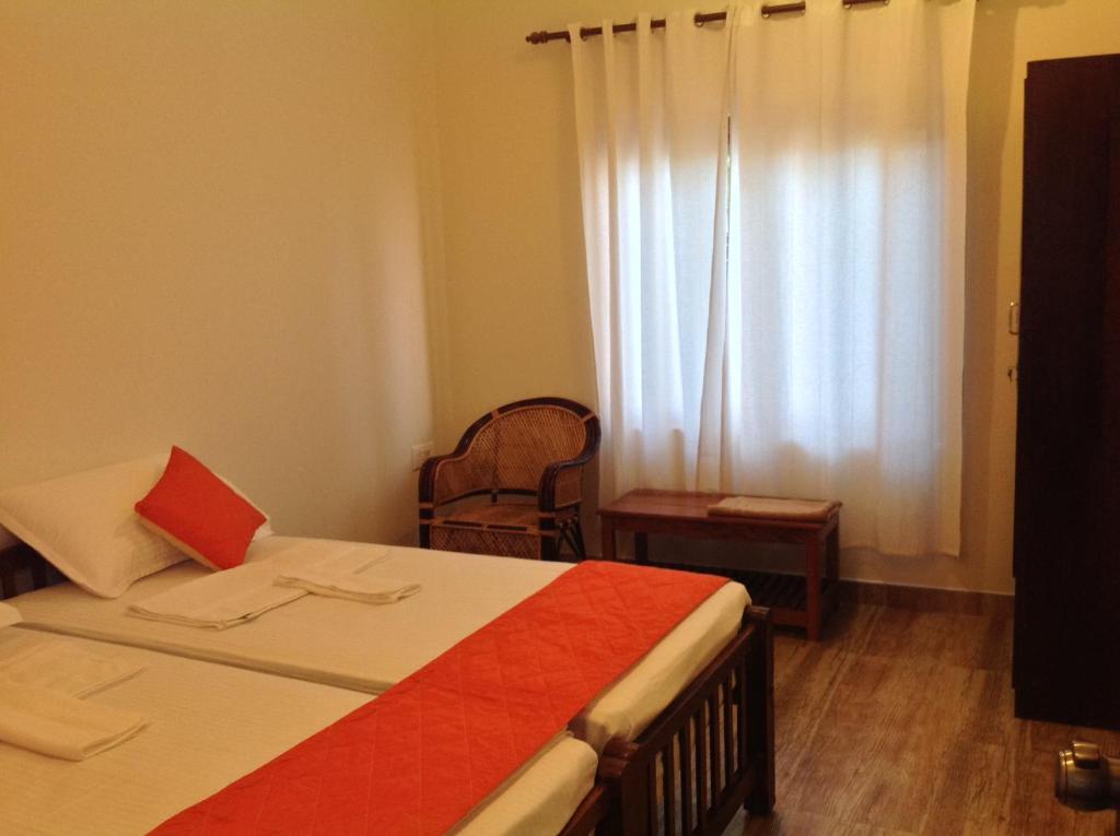 Postel nebo postele na pokoji v ubytování Cherai Onetree Retreat