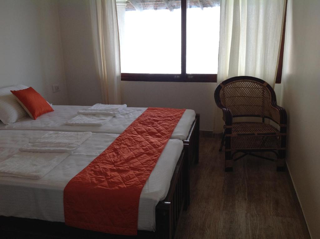Postel nebo postele na pokoji v ubytování Cherai Onetree Retreat