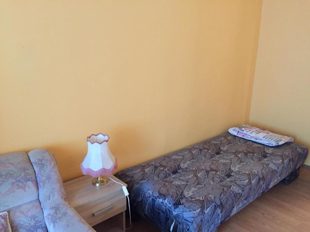 Postel nebo postele na pokoji v ubytování Pálma Apartmanház Siófok
