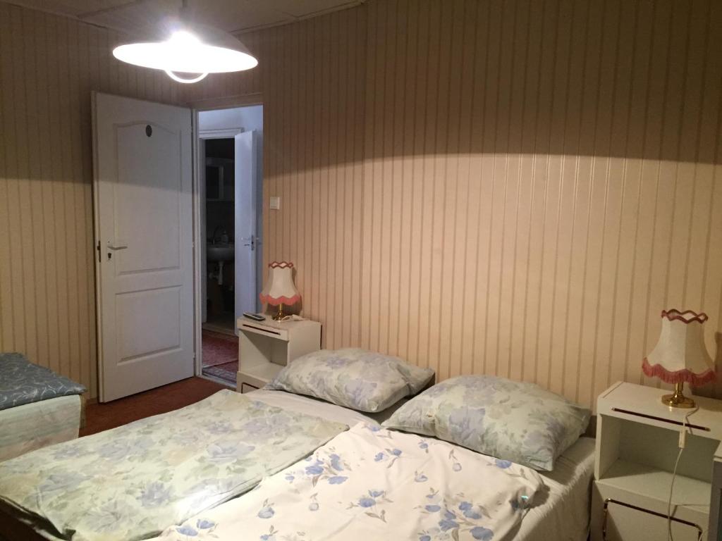 Postel nebo postele na pokoji v ubytování Pálma Apartmanház Siófok