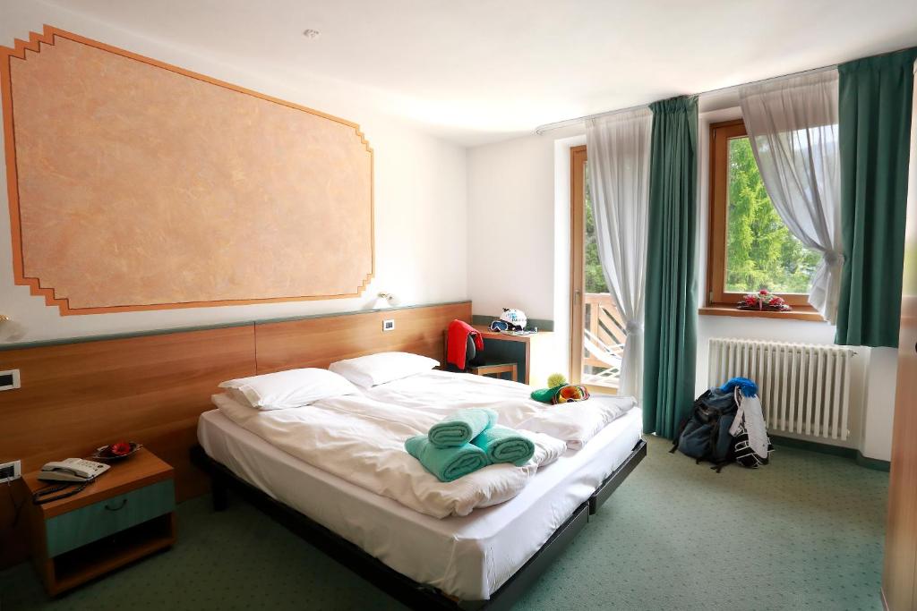 Postel nebo postele na pokoji v ubytování Hotel Fantelli